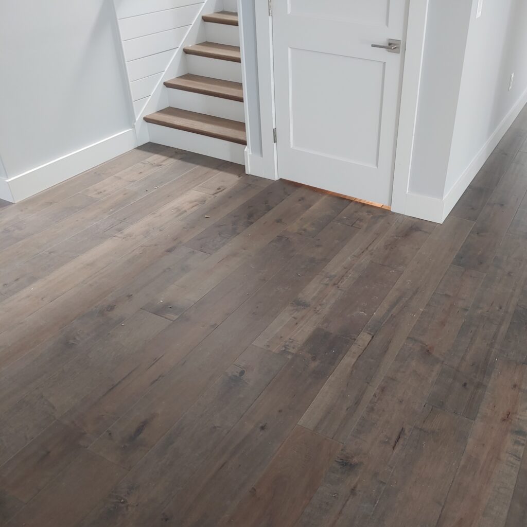 Grey Hardwood on Floor and Stairs